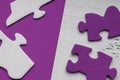 Fragments of the puzzle on a lilac background