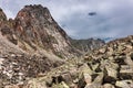 Fragments rock breaking mountains covered with lichen