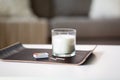 Fragrance candle and matches on tray on table