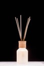Fragrance for home. Aroma diffuser glass jar with aromatic liquid and bamboo sticks