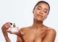 Fragrance, spray and bottle with black woman in studio for beauty, skincare and cosmetics. Perfume, face and model Royalty Free Stock Photo