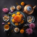 Fragrant Chrysanthemum tea in a teapot with savory snacks on table