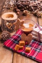 Fragrant coffee, chocolates in the form of Christmas figures. Cookies and hot drink for the holiday. Cozy atmosphere, candles Royalty Free Stock Photo