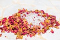 Fragrant dried rose petals with bath salts Royalty Free Stock Photo