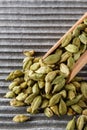 Fragrant green cardamom on a wooden rustic background Royalty Free Stock Photo
