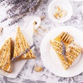 Fragrant homemade honey cake with nuts and lavender on gray concrete background fresh in the horizontal version