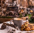 Fragrant hot coffee and chocolate cookies for Santa Claus. A drink for the holiday and a cozy Christmas atmosphere. Free space for Royalty Free Stock Photo