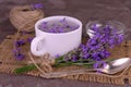 Fragrant lavender tea in a cup bouquet of fresh lavender flowers.Close-up. Royalty Free Stock Photo