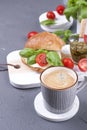 A fragrant morning coffee and a sandwich with mozzarella and basil for breakfast. Tasty and healthy food. Italian lunch. Copy Royalty Free Stock Photo