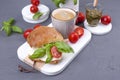 A fragrant morning coffee and a sandwich with mozzarella and basil for breakfast. Tasty and healthy food. Italian lunch. Top view Royalty Free Stock Photo