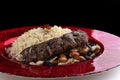 Fragrant Pilaf with Juicy Kabobs, Sweet Raisins, and Nuts Royalty Free Stock Photo