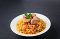 Fragrant Pilau. Pilaf, fried rice with meat and vegetables on a Royalty Free Stock Photo