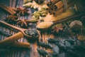 Fragrant spices for Christmas baking on wooden background