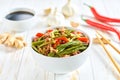 Traditional Chinese food, Szechuan style pork with green beans ginger and hot peppers on a white wooden table Royalty Free Stock Photo