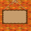 A frame for an announcement is hung against a brick wall Royalty Free Stock Photo