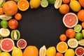 Variety of ripe citruses on black background Royalty Free Stock Photo