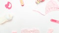 Frame of baby care accessories. Child birth concept. Cute pink baby clothes for girl. white background, top view , copyspace Royalty Free Stock Photo