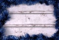 Frame background with blue tinsel garlands