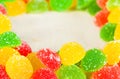 Frame a background colorful sweets of sugar candies