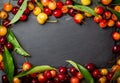 Frame background. Ripe red and yellow cherry. Top view Royalty Free Stock Photo