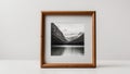 Frame with black and white photo of landscape on grey background. Royalty Free Stock Photo