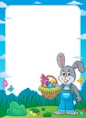 Frame with bunny holding Easter basket Royalty Free Stock Photo