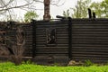 Frame of a burnt wooden building with a brick pipe Royalty Free Stock Photo