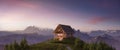 A-frame Cabin home on top of a mountain with rocky peaks.