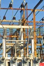 Frame, cables, transformers, and insulators of an electrical sub-station. Royalty Free Stock Photo