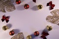 Frame of christmas balls  bows and tropical golden leaves Royalty Free Stock Photo