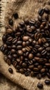 Frame Coffee beans scattered on rough sacking for a rustic feel Royalty Free Stock Photo