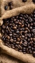 Frame Coffee beans scattered on rough sacking for a rustic feel Royalty Free Stock Photo