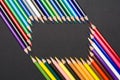 Frame of colored pencils isolated on black cardboard Royalty Free Stock Photo