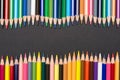 Frame of colored pencils in wave shape Royalty Free Stock Photo