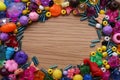 Frame of colorful beads on wooden background, flat lay. Space for text Royalty Free Stock Photo