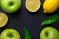 Frame composition from fresh raw green organic apples juicy lemons leaves on black background. Healthy lifestyle vitamins detox Royalty Free Stock Photo
