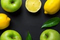 Frame composition from fresh raw green organic apples juicy lemons leaves on black background. Healthy lifestyle vitamins detox Royalty Free Stock Photo