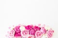 Frame composition of pink rose flowers on white background. Flat lay, Top view. Flowers texture. Royalty Free Stock Photo