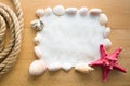 Frame with copy space decorated by seashells and red starfish Royalty Free Stock Photo