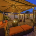 Frame Cozy outdoor seating area under a pavilion on the patio paved with stone bricks Royalty Free Stock Photo