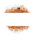 Frame of crushed red cayenne pepper, red papper paprica, dried chili flakes, seeds and wooden scoop isolated on a white