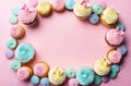 Frame of cupcakes on a pink background