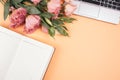 Frame of decorative women`s notebook and with eustoma flowers, top view. Flat lay floral arrangement on white background Royalty Free Stock Photo