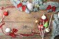 Frame of delicious Christmas themed cake pops on wooden table, flat lay. Space for text Royalty Free Stock Photo