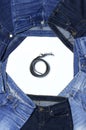 Frame of different blue jeans and leather belts isolated on white background top view flat lay. Detail of nice blue Royalty Free Stock Photo