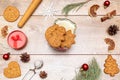 Frame of different delicious Christmas gingerbread cookies, decorations with gift box on wooden table, flat lay. Copy Royalty Free Stock Photo
