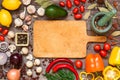 Frame of different fresh organic vegetables and spices on wooden table. Healthy natural food background with copy space. Royalty Free Stock Photo