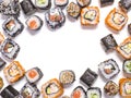 Frame of different Japanese food rolls set on white background. Royalty Free Stock Photo