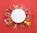 Frame of festive items on red background, flat lay with space for text. Surprise party concept Royalty Free Stock Photo