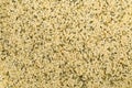 Frame filling background texture of raw, organic hemp seeds